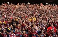 Football fans bring a game to life.